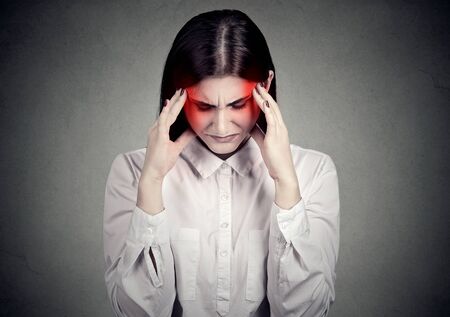 Sad stressed woman with headache 