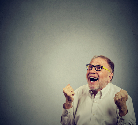 Happy senior man celebrating successの写真素材