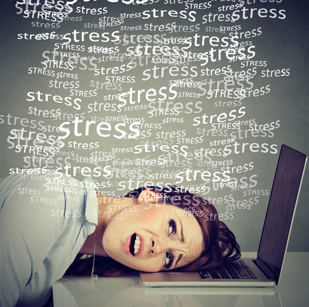 Stressed desperate woman with laptop under pressure of work problems. Employee long working hours...