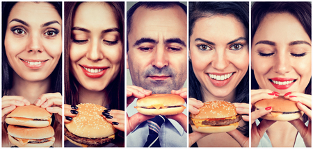 Group of happy people eating cheeseburgersの写真素材