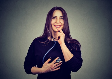 woman listening to her heart with stethoscope