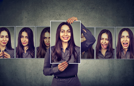 Masked woman expressing different emotionsの写真素材