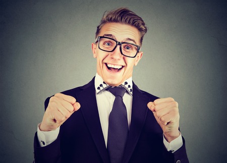 Happy excited young man in glasses  の写真素材