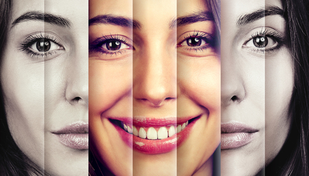 Serious woman hiding happy emotionsの写真素材