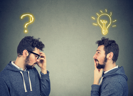 Two men thinking one has a question another solution with light bulb above head isolated on gray...