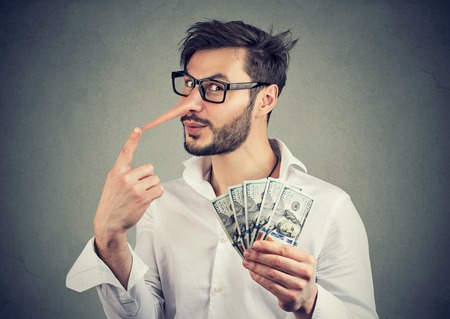 Financial fraud concept. Liar business man with dollar cash 
