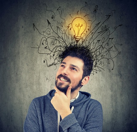 young happy man has a bright idea の写真素材