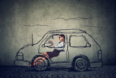 happy young woman driving a carの写真素材