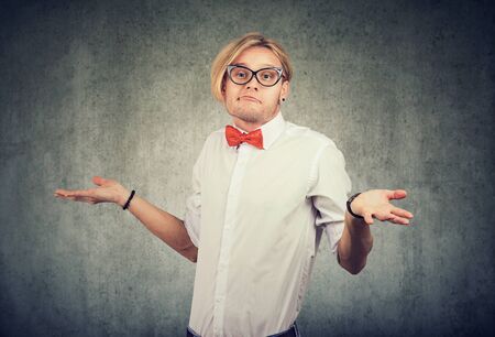 Clueless funny looking man with no answer の写真素材