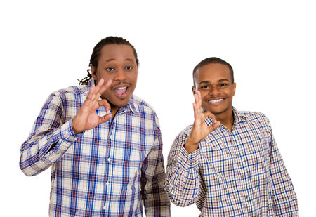 portrait handsome happy, young men giving ok sign gesture symbol, with hand isolated white background.の写真素材