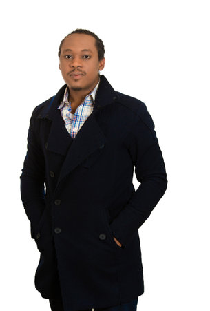 Portrait of a confident young man wearing black coatの写真素材