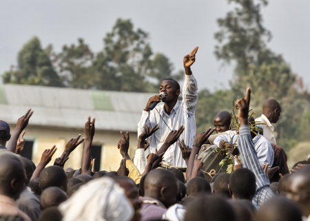Mbale, Uganda - February 14, 2011: Young activist speaking at an opposition rally, held by FDC Forum for Democratic Change running for the Ugandan parlamentary electionsのeditorial素材