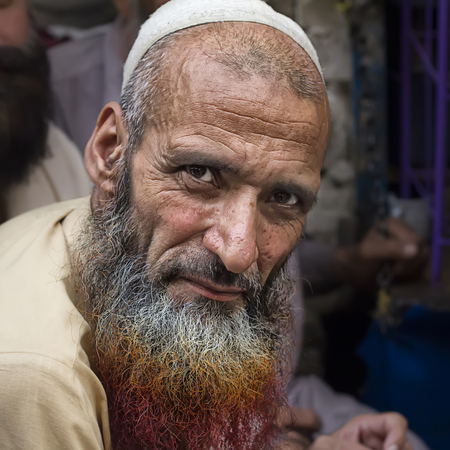 Lahore, Pakistan - April 26, 2013: Pashto refugee in Pakistan with henna dyed beard. According to UNCHR there are 1.6 million registered afghan refugees in Pakistan, and more than 1 million illegal non-registered ones.のeditorial素材