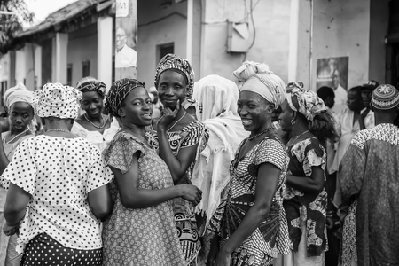 Gabu, Guinea-Bissau - March 28, 2014: african women gathering for a wedding cerimonyのeditorial素材