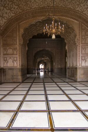 Lahore, Pakistan - April 27, 2013: Interior hall and archway in Badshahi Mosque, the main attraction and pilgimage site in Pakistanのeditorial素材