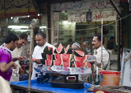 watermelon vendors at the bazaar and Their clientsのeditorial素材