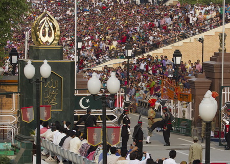 Lahore, Pakistan - May 5, 2013: The India-Pakistan Wagah Border Closing Ceremony. The flag ceremony happens at the border gate, two hours before sunset each day.のeditorial素材