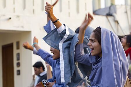 Lahore, Pakistan - May 5, 2013: female muslim students protest at a political rally in Lahoreのeditorial素材