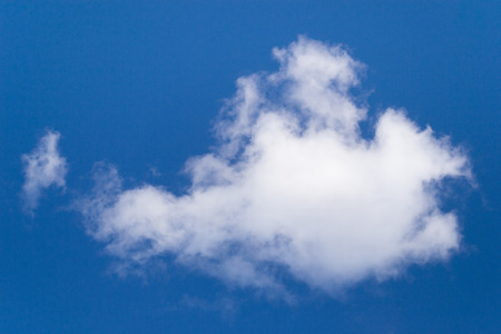 Bright blue sky with cloudsの写真素材
