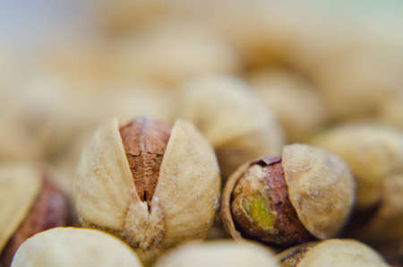 A close up of a roasted and salted pistachio nut  の写真素材