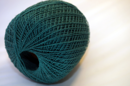 Fine merino yarn in teal color  (macro shot)の写真素材