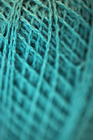 Fine merino yarn in teal color  (macro shot)の写真素材