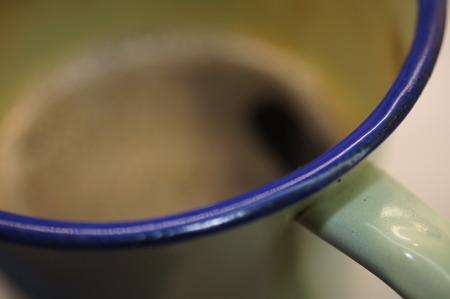 Black Coffee Close-up in a green pewter cup (Detail Macro shot)の写真素材
