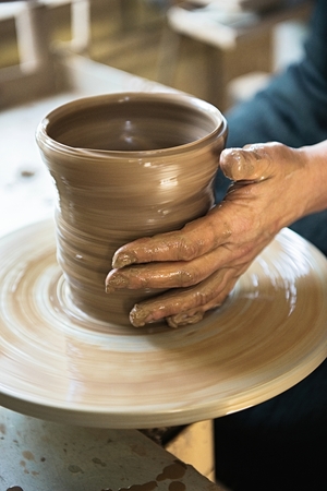 A lace maker and ceramicist create artwork. Hands top viewの写真素材