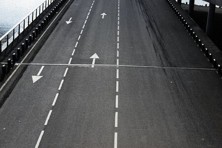 White forward traffic arrow on the road