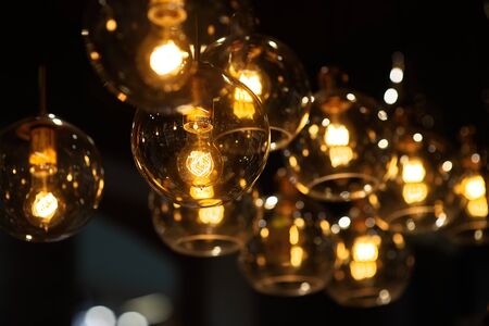Decorative mason jar style yellow light bulbsの写真素材