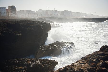 beautiful African rugged coastline with waves crashing against the cliffs