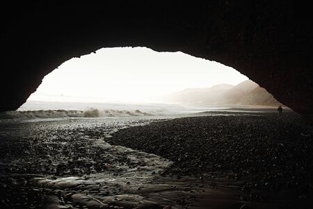 Legzira dramatic natural stone arches reaching over the sea, Atlantic Ocean, Morocco, Africaの写真素材