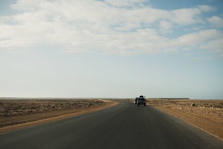 Morocco , Africa, January 18, 2020: Off road jeep is driving along the road towards Africa