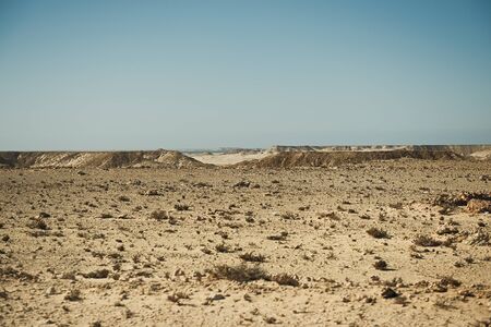 extreme adventures or science expedition in a stone desert. Sahara desert at sunrise - mountain...