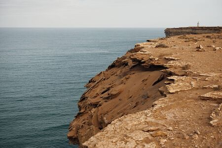 beautiful African rugged coastline with waves crashing against the cliffs