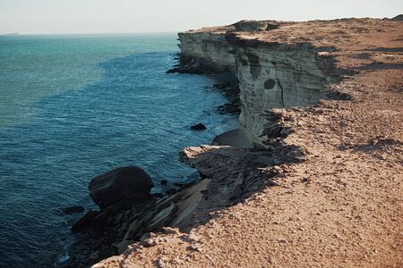 beautiful African rugged coastline in Mauritania with waves crashing against the cliffsの写真素材