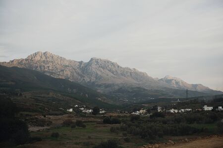 Autumn view of the mountain, brown and yellow slopes of the mountains in Africa with blue cloudy sky...