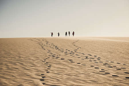 Nouadhibou, Mauritania, JANUARY 18, 2020: Group of people on top of a mountain in the Mauritania desertのeditorial素材