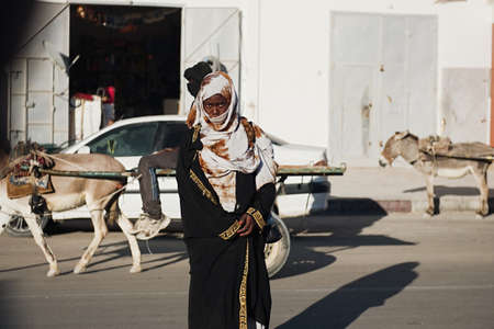 Nouadhibou, Mauritania, JANUARY 18, 2020: Portrait of a tribal African woman decorated with traditional colorful beads.のeditorial素材