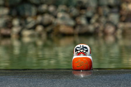 One Dharma placed by the pondの写真素材