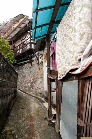 A hilly town with a blue roofの写真素材