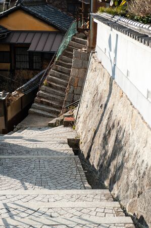 A town with a slope where the light strikes and shadowsの写真素材