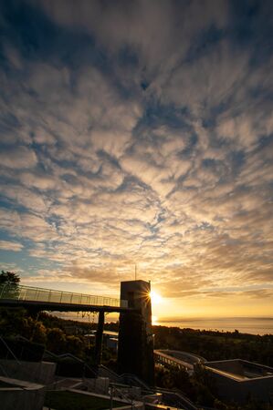 Beautiful cloud sunrise and buildingsの写真素材