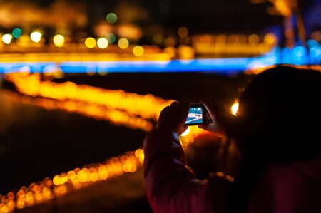 A person who shoots a lot of illumination with a smartphoneの写真素材