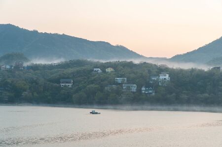 Lake and villa surrounded by morning glory