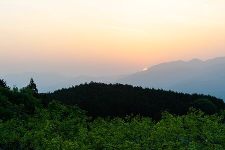 Asahi rising from Nara vineyard and mountainの写真素材