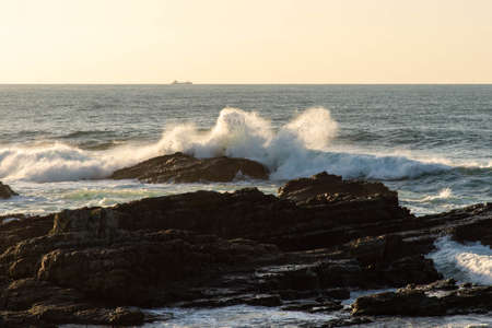 Morning sea, waves made of rocks
