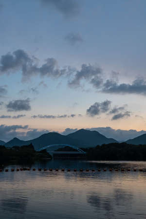 The lake reflected in the morning sky