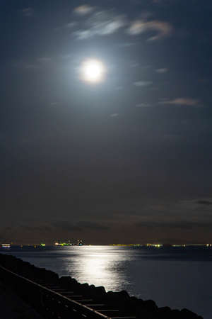 Full moonlight and reflection in the seaの写真素材