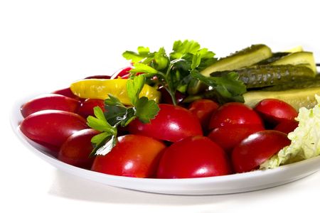 delicious salad made from saulty tomatoes and cucmbers with pepperoniの写真素材